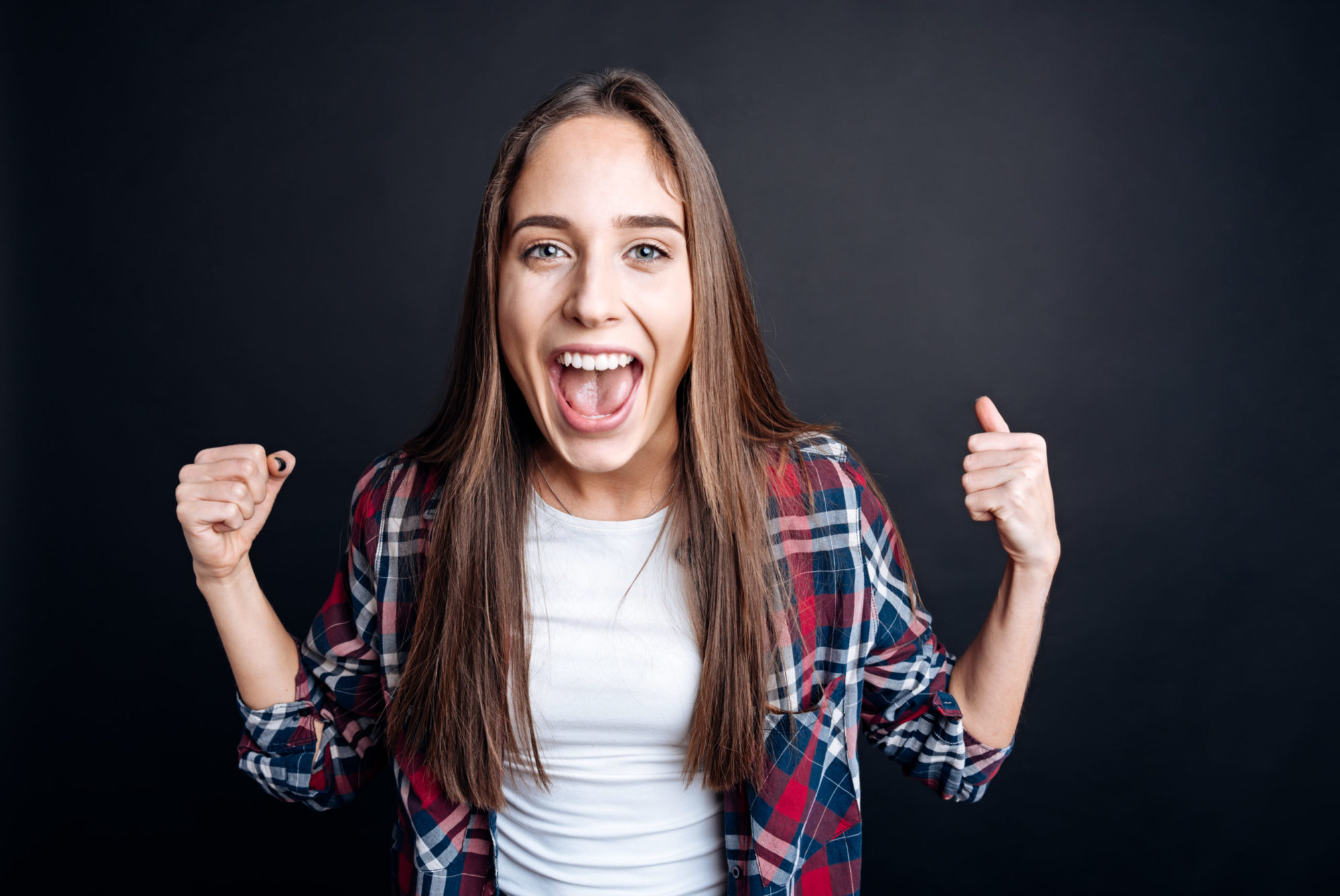 Cheerful woman expressing joy brooklyn orthodontics