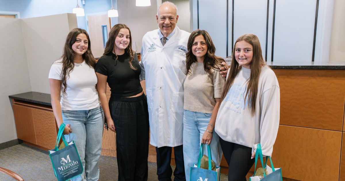 Brooklyn Orthodontist, Dr. Mizarahi, with happy, smiling patients